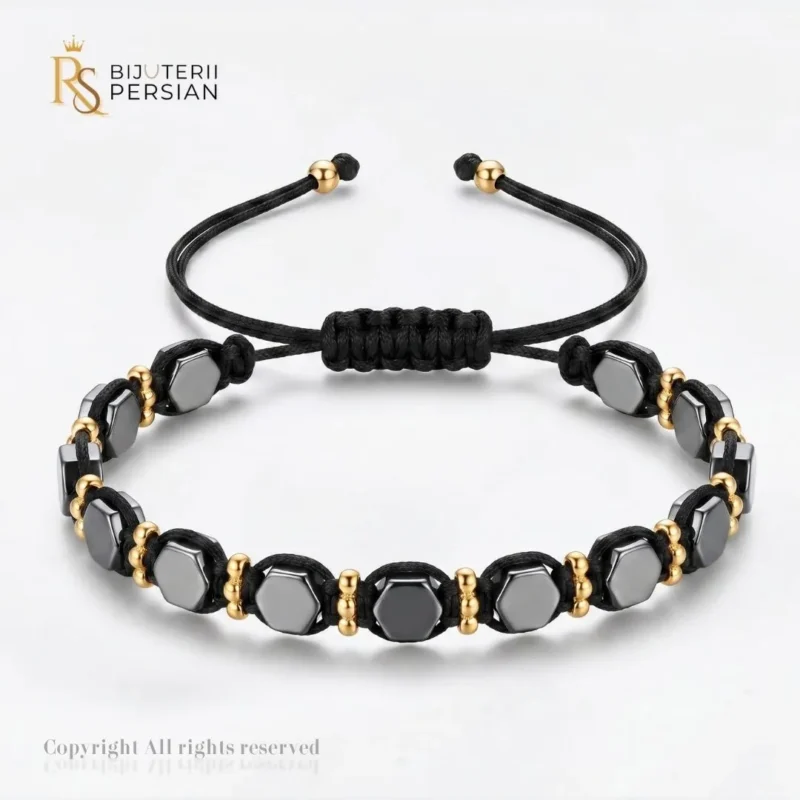 Cumperi o bratara aur galben cu snur si hematit hexagonal din aur 14K cu mărgele din hematit, biluțe din aur și nod reglabil. Comandă online!