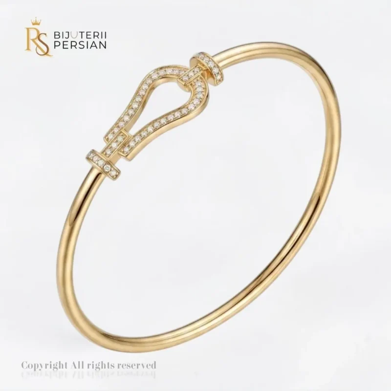 Bratara fixa aur galben potcoava din aur 14K cu motiv central arcuit incrustat cu cristale de zirconiu