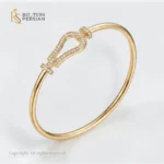 Bratara fixa aur galben potcoava din aur 14K cu motiv central arcuit incrustat cu cristale de zirconiu