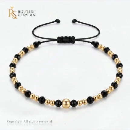 Bratara aur galben cu snur si spinel alternat din aur 14K cu bila centrala si margele de aur si spinel negru alternate simetric