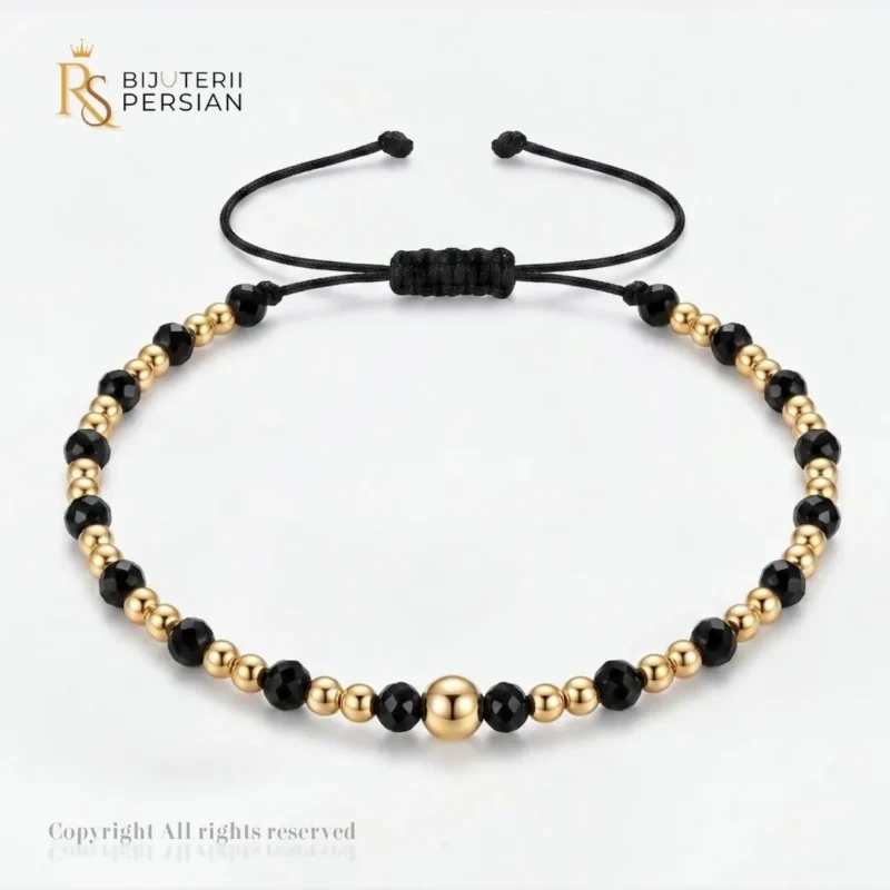 Bratara aur galben cu snur si spinel alternat din aur 14K cu bila centrala si margele de aur si spinel negru alternate simetric