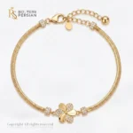 Bratara aur galben dama cu floare si zirconiu din aur 14K cu element floral central si lant herringbone impletit
