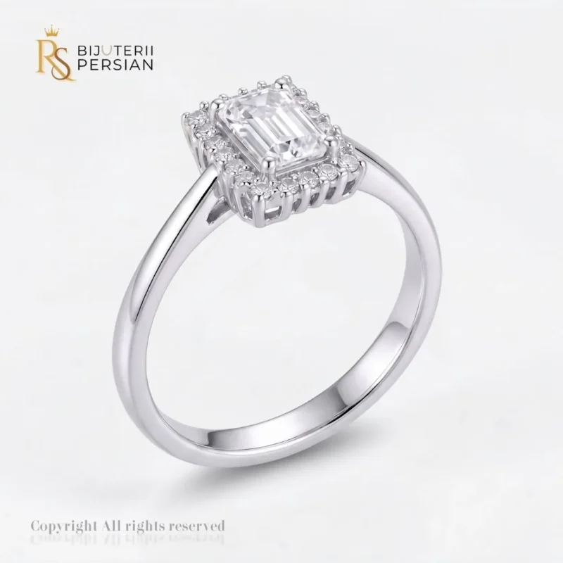 Inel aur alb taietura smarald cu zirconiu din aur 14K cu cristal central dreptunghiular si contur halo incrustat